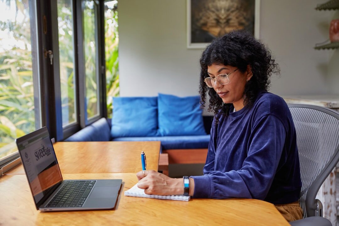 writer at desk with notebook